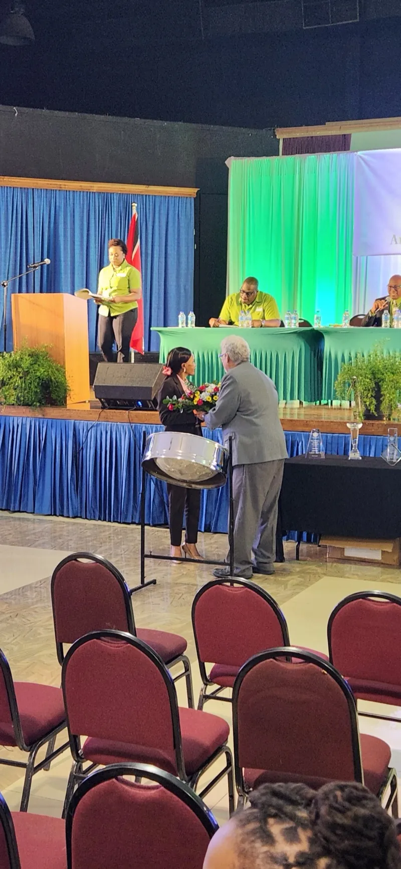 A speaker addresses the audience from the podium at the 72nd AGM